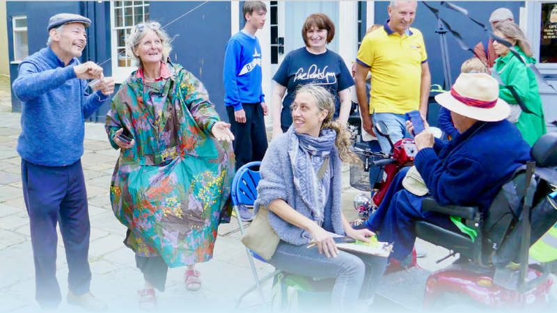 Group of people of all ages, genders and ability on a street being happy