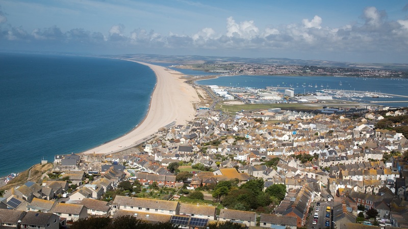 Chesil Beach with housing in the foreground