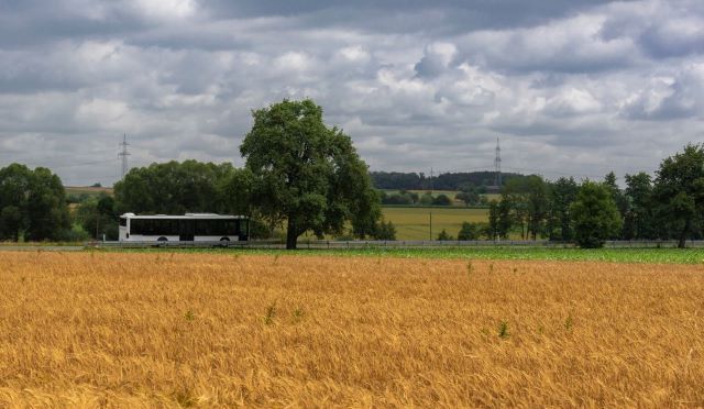 Countryside view with bus driving through