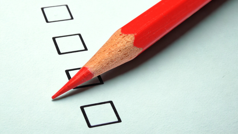 Close up of red pencil on survey form